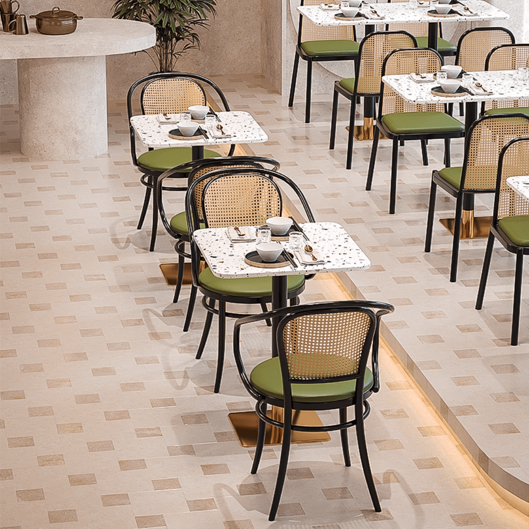 Rattan dining chairs with durable terrazzo table for an elegant dining setup