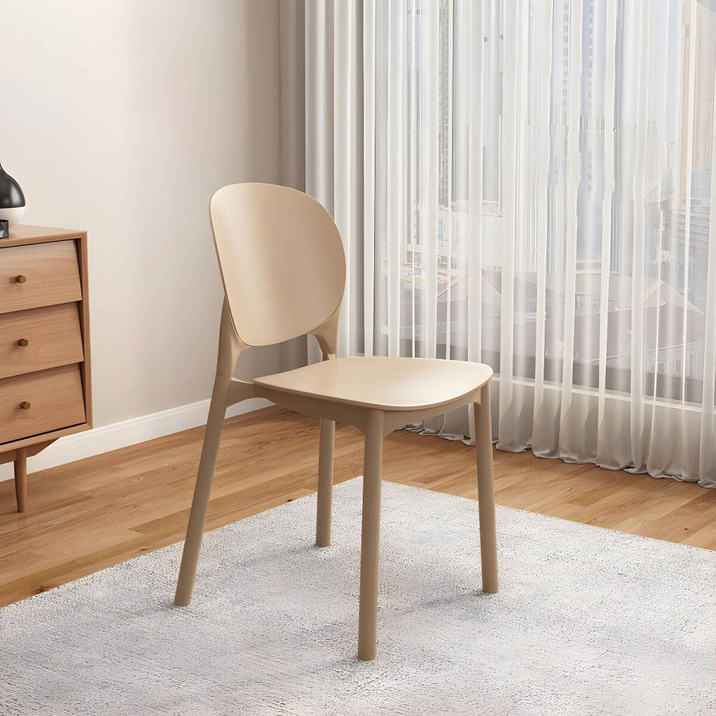 Stackable Scandinavian side chair with open back made of plastic and acrylic for dining