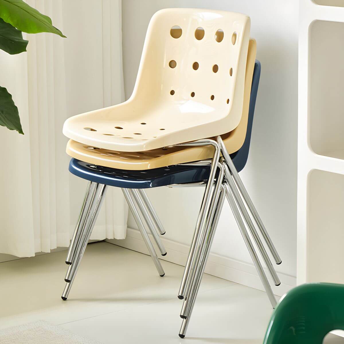 Stackable Scandinavian plastic and acrylic side chair with low back for dining