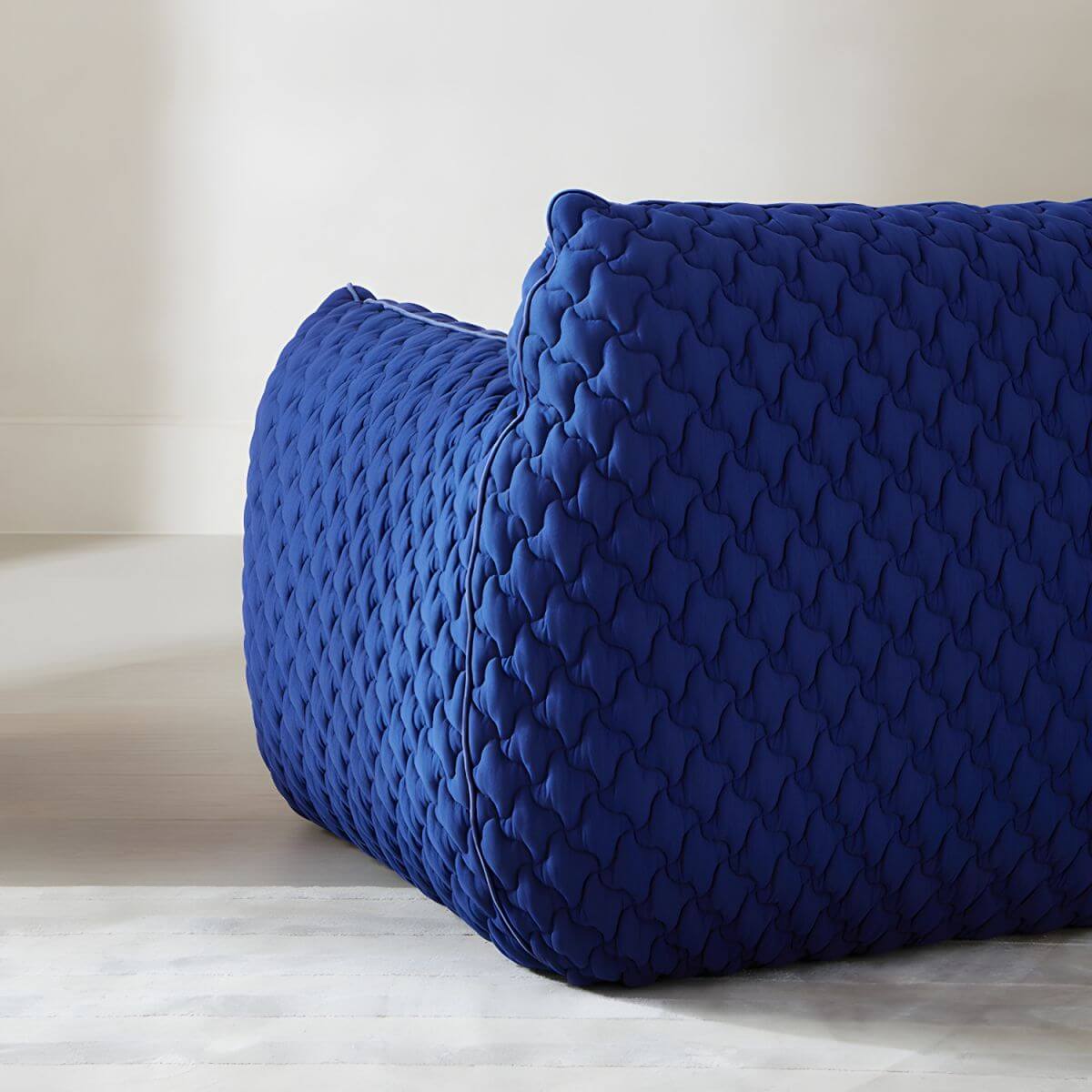 Light gray Scandinavian single sofa chair with polyester twill upholstery, ideal for bedroom seating