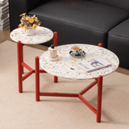 Round side table with vibrant red terrazzo top, featuring a modern minimalist design