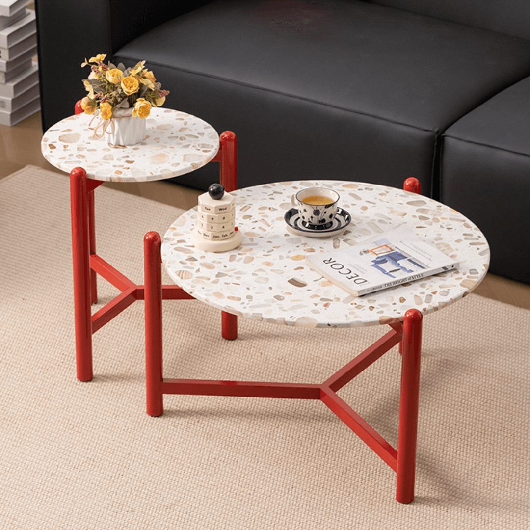 Round side table with vibrant red terrazzo top, featuring a modern minimalist design