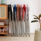 Modern collapsible open back side chair made of plastic and acrylic, ideal for kitchen and dining areas