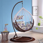 Metal porch swing with cushions, chain, and stand, designed to be heat resistant for outdoor use