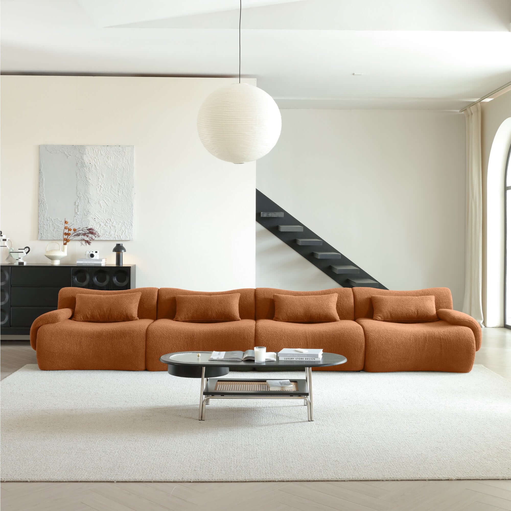 Modern sectional sofa upholstered in soft teddy velvet fabric with modular design