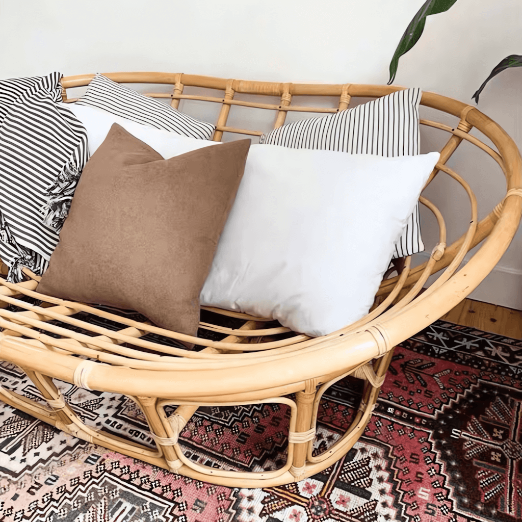 Cozy natural rattan papasan chair available in single or double size for comfortable lounging