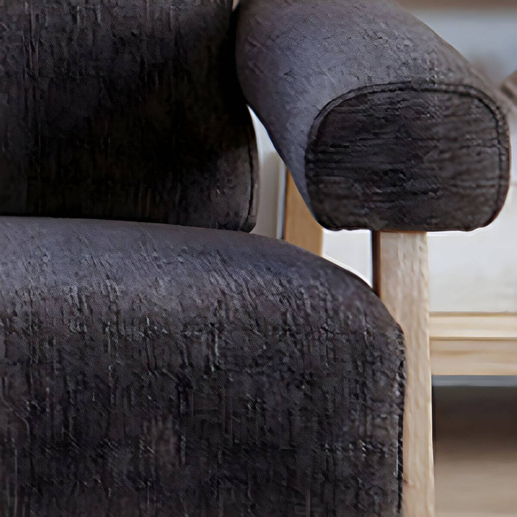 Black Scandinavian style small sofa with wood frame and faux leather upholstery