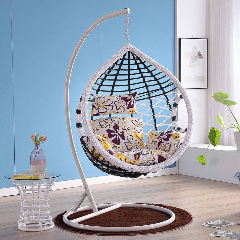 Metal porch swing with cushions, chain, and stand, designed to be heat resistant for outdoor use