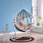 Metal porch swing with cushions, chain, and stand, designed to be heat resistant for outdoor use