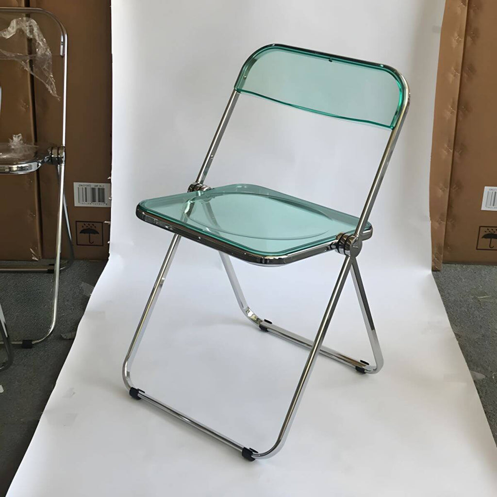 Contemporary acrylic folding armless chair with open back, ideal for dining rooms