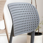Stackable Scandinavian style plastic and acrylic side chair with low back for dining