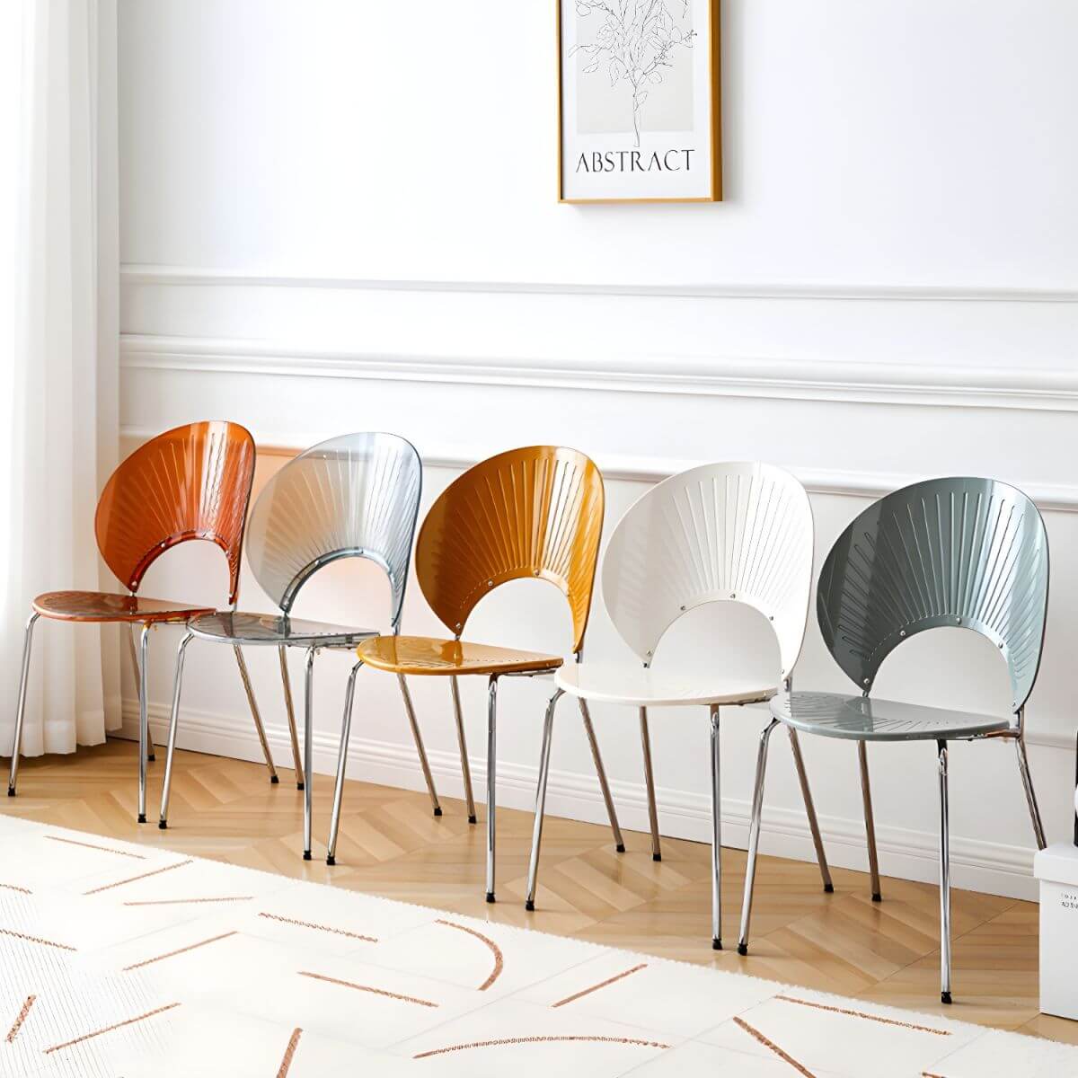 Stackable acrylic dining chair with open back and metal legs, armless design for modern dining rooms