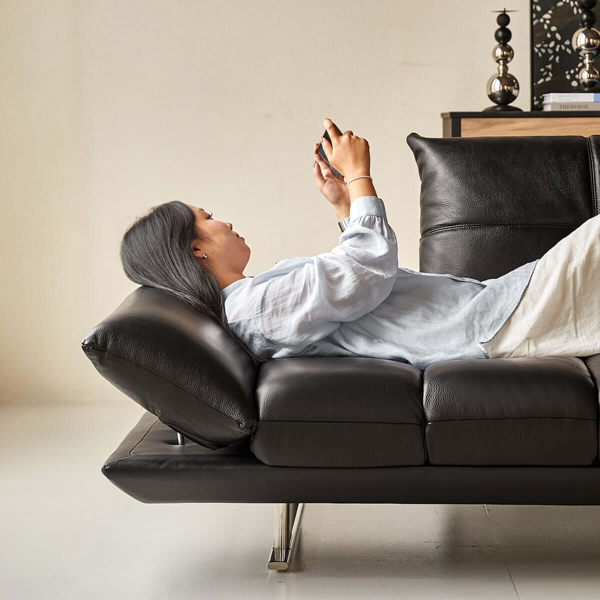 Double sided leather upholstered sofa designed for living room comfort and style