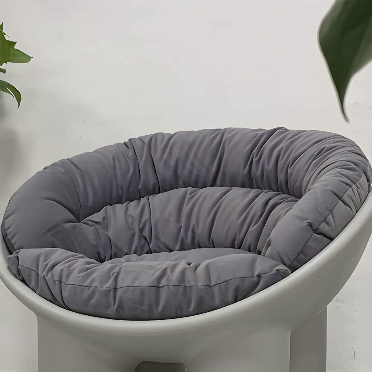 Modern armless papasan accent chair with bowl shape and elephant legs