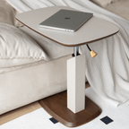 Movable end table in classic beige saddle leather, perfect for cozy living spaces