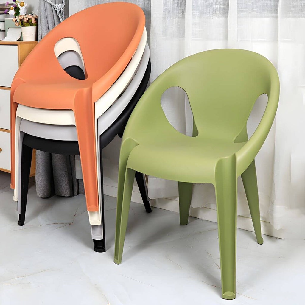 Stackable modern arm chair with open back made of plastic and acrylic for dining
