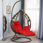 Two-seater metal porch swing egg chair with stand, cushions, and chain included
