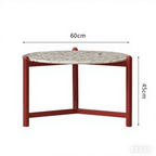 Round side table with vibrant red terrazzo top, featuring a modern minimalist design