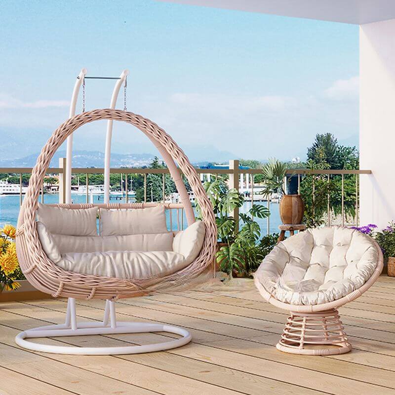 Pink metal 2-seater porch swing with stand, chain, and cushions for outdoor seating