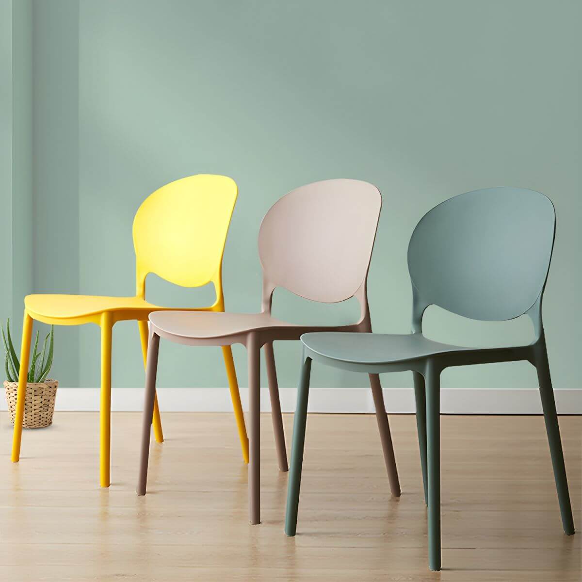 Scandinavian plastic dining chair with open back and four legs, ideal for home use
