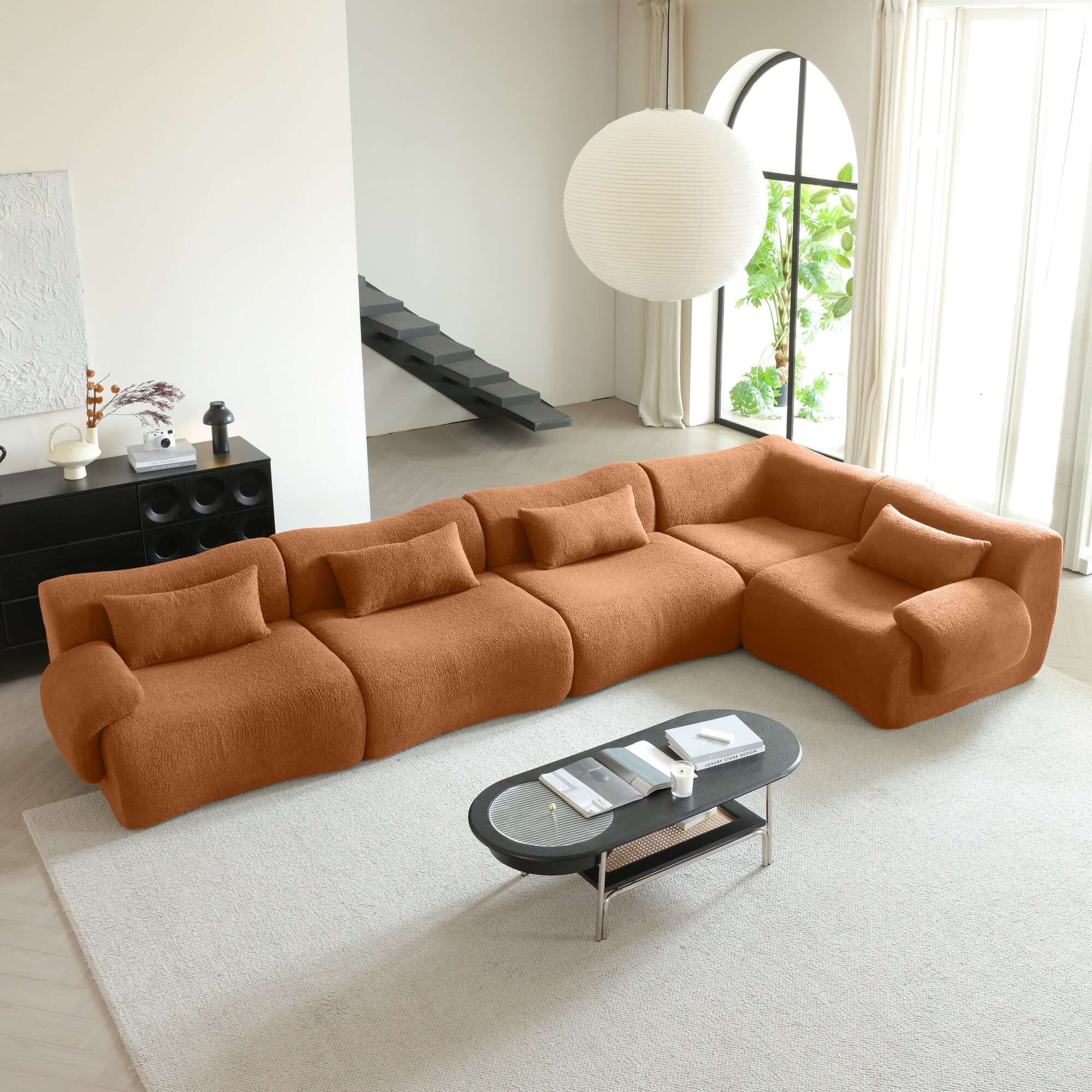 Modern sectional sofa upholstered in soft teddy velvet fabric with modular design