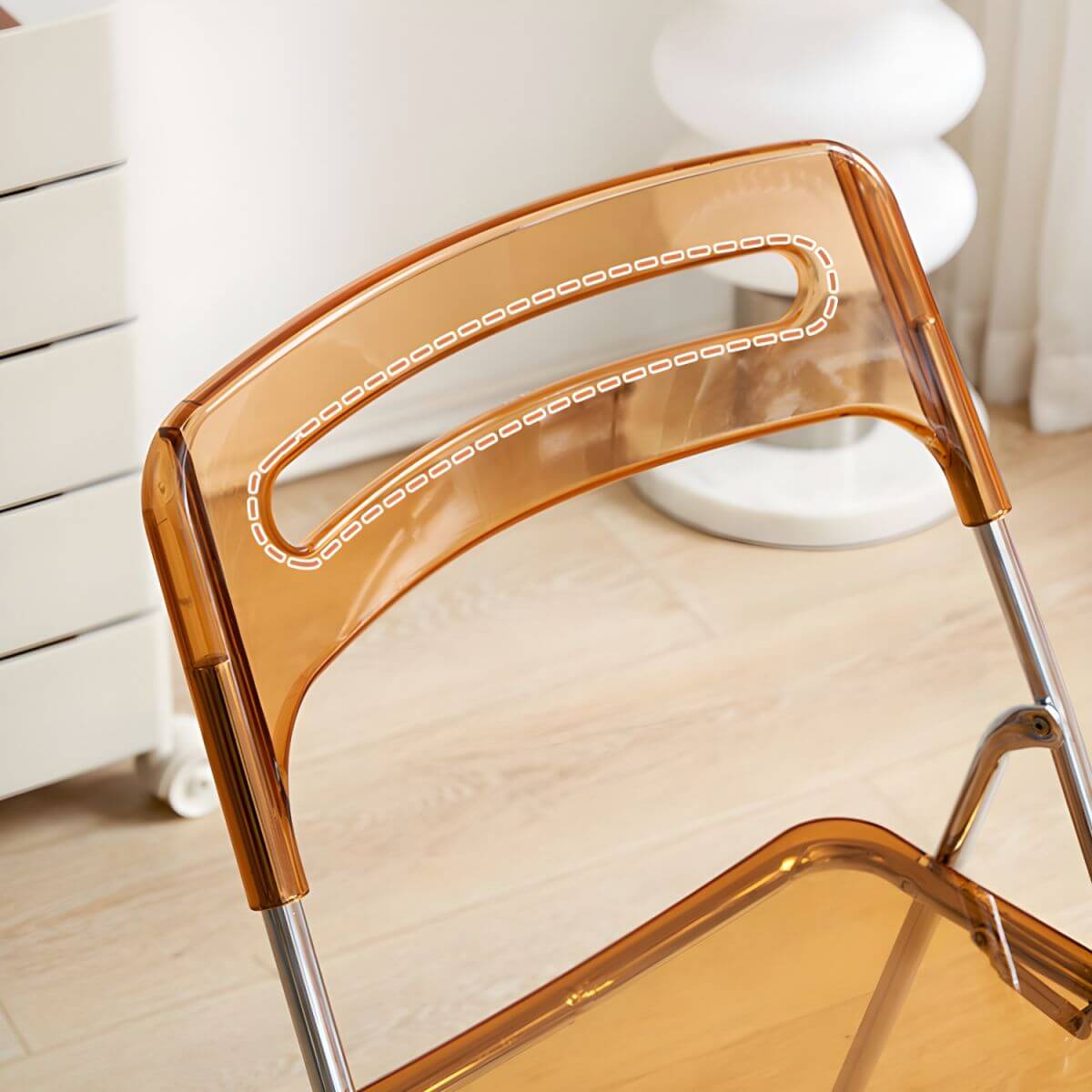 Modern collapsible open back side chair made of plastic and acrylic, ideal for kitchen and dining areas