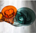 Cloud-shaped modern glass coffee table set with two pieces in vibrant orange, green, purple, and black