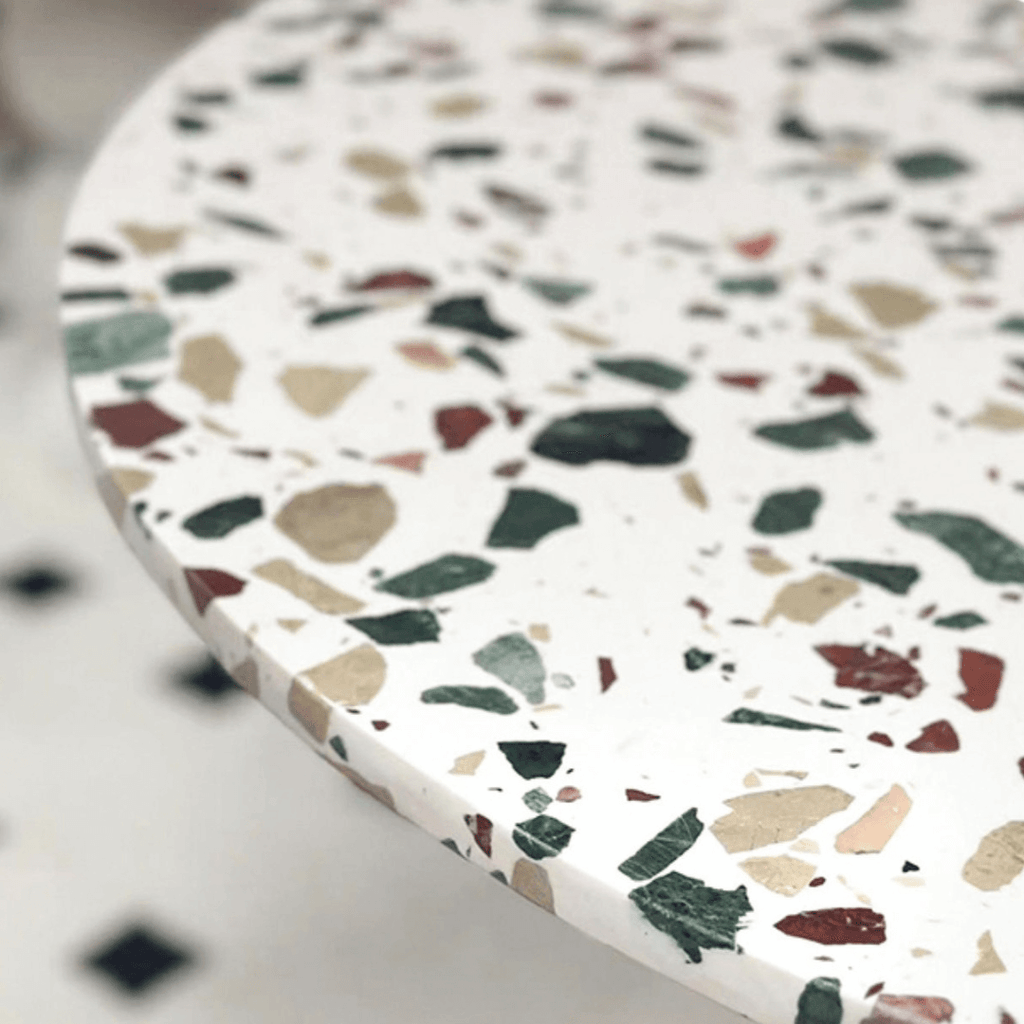 Half-elliptical terrazzo dining table with multicolor mosaic design, durable and stylish