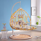 Metal porch swing with cushions, chain, and stand, designed to be heat resistant for outdoor use