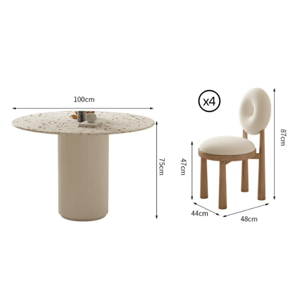 Round terrazzo dining table with soft wool upholstered chairs for a trendy home setup