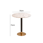 Rattan dining chairs with durable terrazzo table for an elegant dining setup