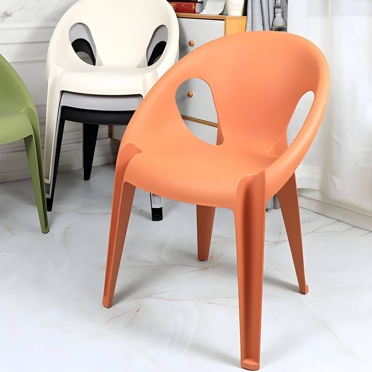 Stackable modern arm chair with open back made of plastic and acrylic for dining