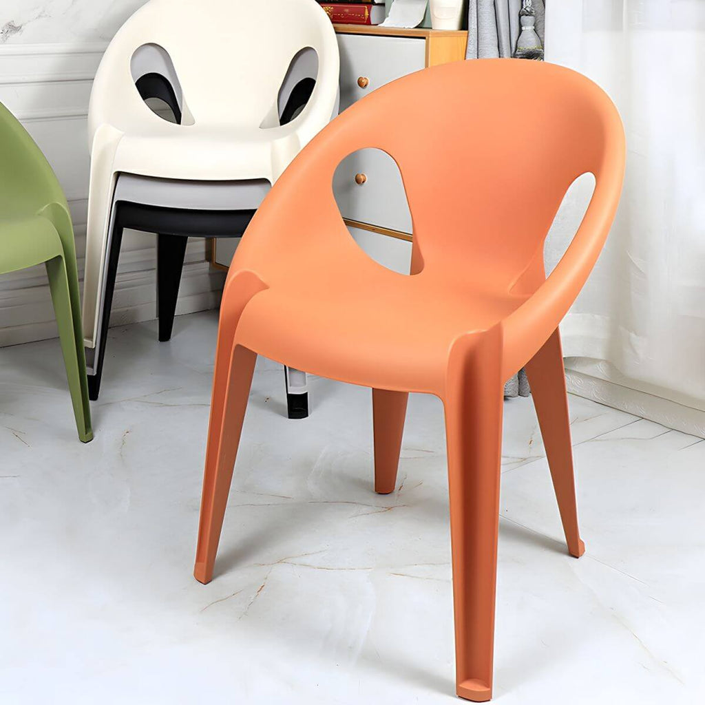 Stackable modern arm chair with open back made of plastic and acrylic for dining