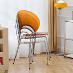 Stackable acrylic dining chair with open back and metal legs, armless design for modern dining rooms