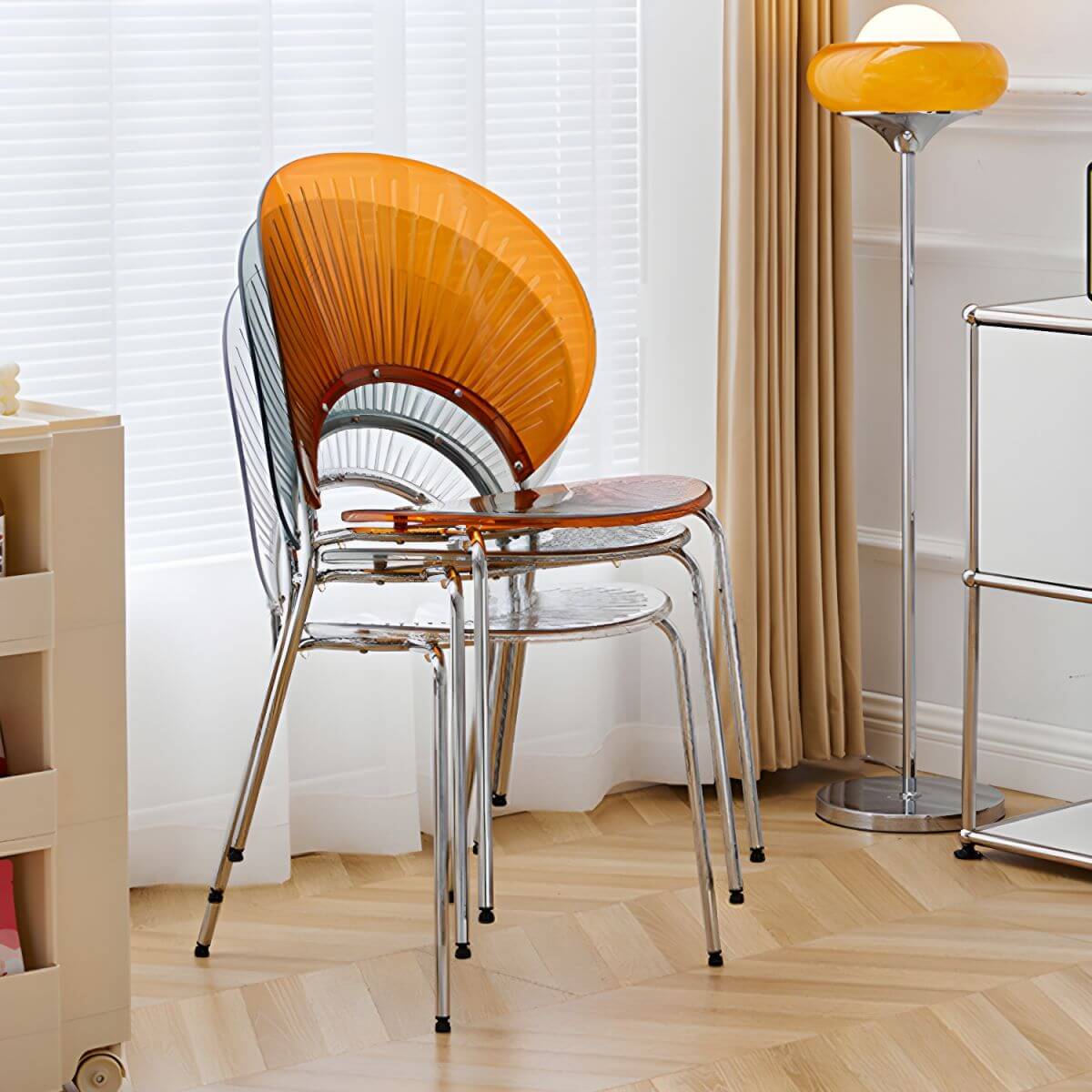 Stackable acrylic dining chair with open back and metal legs, armless design for modern dining rooms