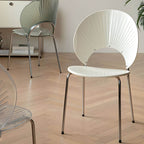 Stackable Scandinavian style dining chair with plastic seat, acrylic back, and silver legs