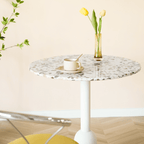 Round terrazzo table ideal for dining or office use with versatile design