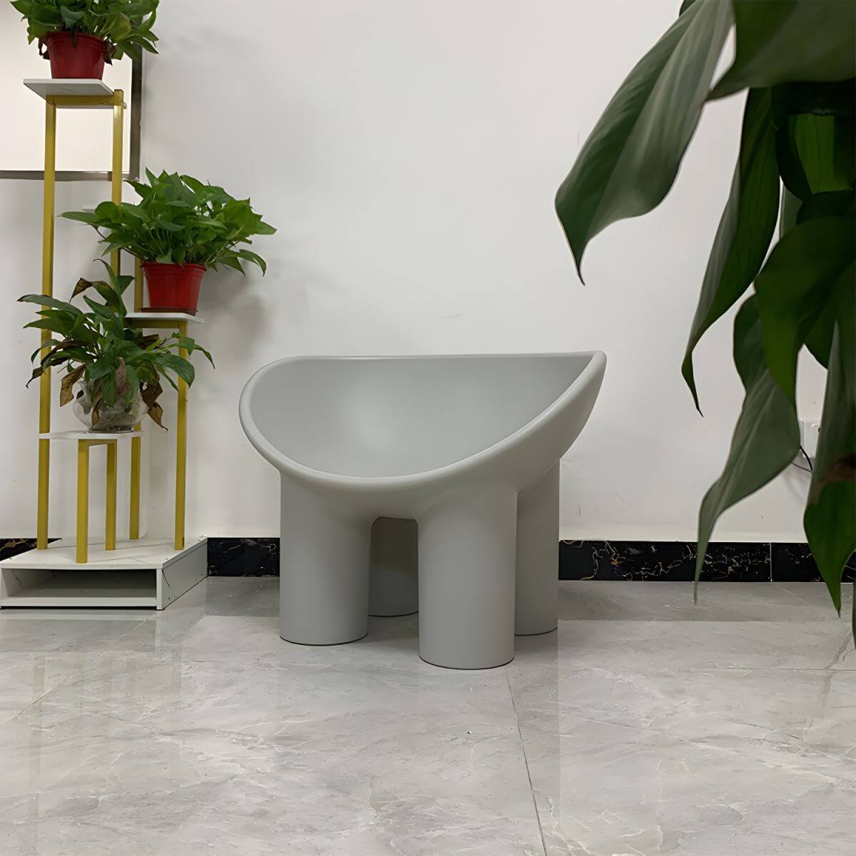 Modern armless papasan accent chair with bowl shape and elephant legs