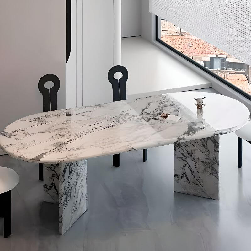 Oval dining table with white marble top and fixed base, perfect for contemporary dining rooms