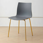 Modern plastic and acrylic side chair with metal legs, ideal for kitchen and dining rooms
