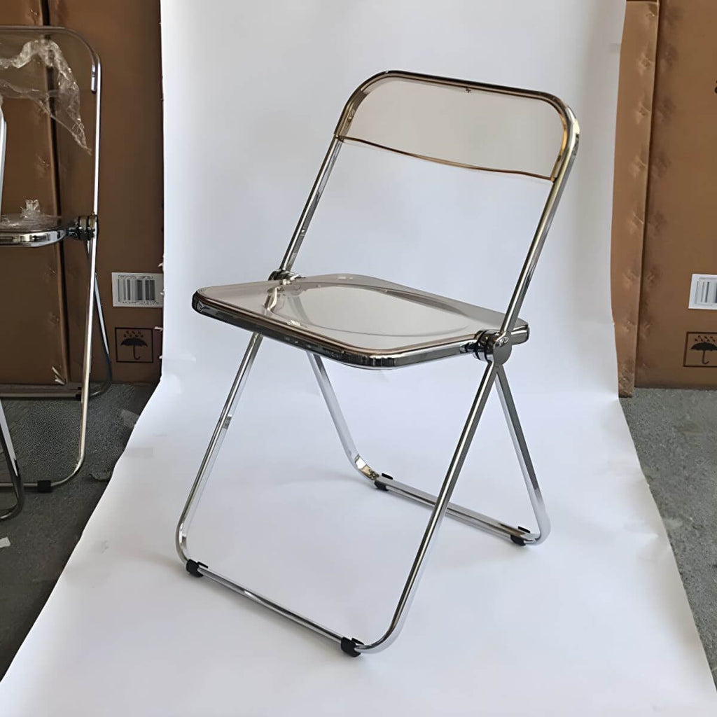 Contemporary acrylic folding armless chair with open back, ideal for dining rooms