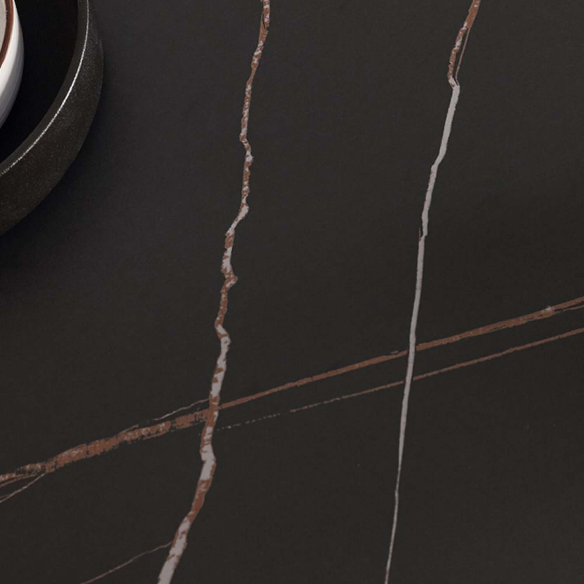 Black marble dining table with sintered stone top and X-base, measuring 70.87 inches