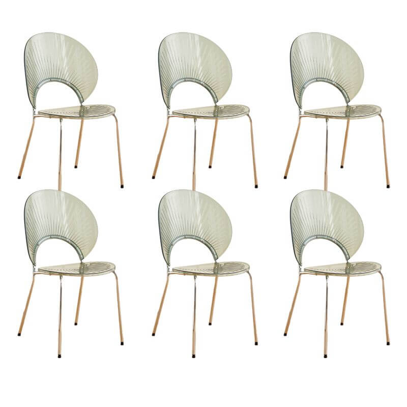 Stackable Scandinavian style dining chair with plastic seat, acrylic back, and silver legs