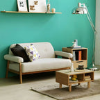 Black Scandinavian style small sofa with wood frame and faux leather upholstery