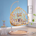 Metal porch swing with cushions, chain, and stand, designed to be heat resistant for outdoor use