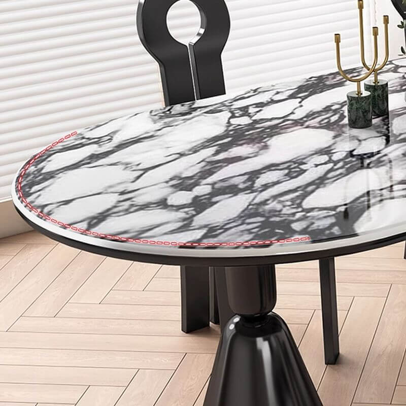 Oval marble dining table set with dual footing, solid back panel, and cushioned chairs