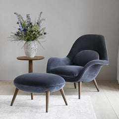 Nordic modern single sofa lounge chair with ottomans and velvet fabric cushion in elegant living room setting