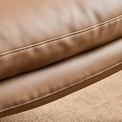 Sewn pillow back arm chair in living room