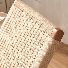 White wicker rocking chair with natural leg color