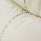 Beige oversized rocking chair